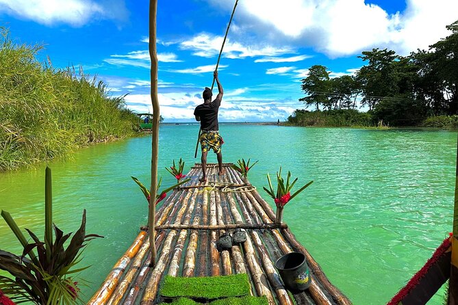 Bamboo Rafting and Horseback Riding on Beach in Ocho Rios - Bamboo rafting on calm river water, plus the limestone foot massage