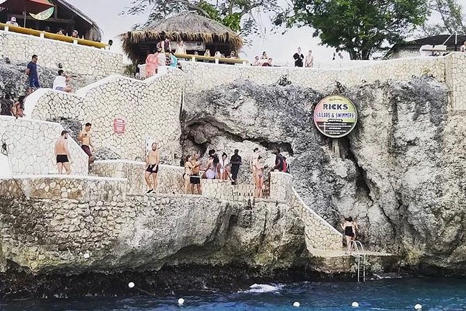 Bamboo Rafting and Limestone Foot Massage with Ricks Cafe Private Tour - Lethe Estate Bamboo Rafting: 30-Foot Craft and a Cultural Rhythm