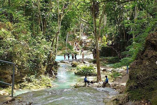 Combo Tour Dunn's River Falls and BlueTour from falmouth - Blue Hole: rope swing, cliff jumping options, and a cool underwater cave