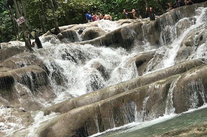 Dunns River Falls Experience from Montego Bay Resorts - The beach payoff: waterfall ends in the Caribbean Sea