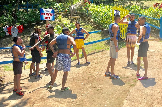 Explore Montego bay Jamaica toMartha Brae Rafting &Blue Hole Tour - Martha Brae rafting on a hand-made bamboo raft