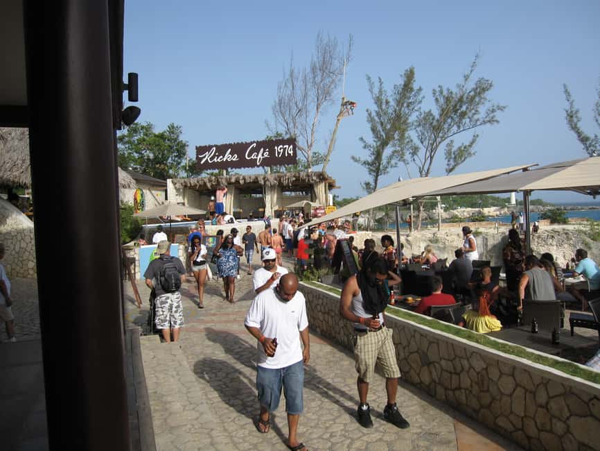 From Montego Bay: Negril Day Trip and Rick's Café Sunset - Ricks Café sunset: cliff divers, reggae music, and the show you came for