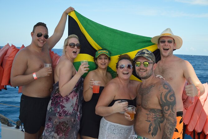 Montego Bay Catamaran: Snorkel Tour with Open Bar & Reggae DJ - Drinks, Snacks, and the Ladies Foot Massage Perk