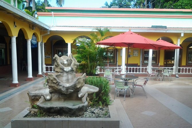 Montego Bay Excursion Negril 7 Miles Beach, Rick's Cafe and Time Square Shopping - Ricks Cafe: cliff divers, reggae, and that late-day wow