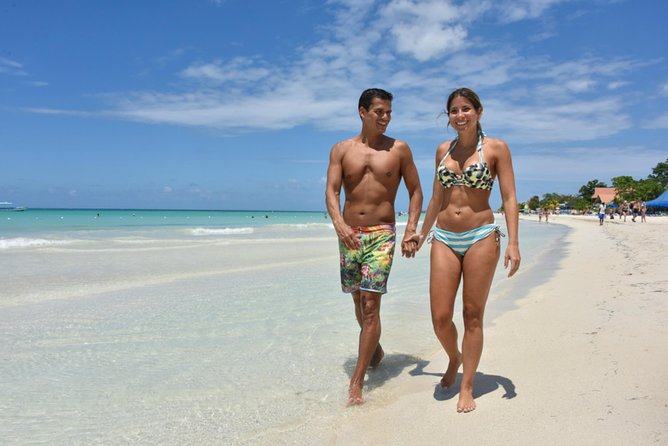 Negril Highlights Catamaran Cruise With Stop At Margaritaville - Catamaran energy: live DJ, open bar, and the Seven Mile Beach glide