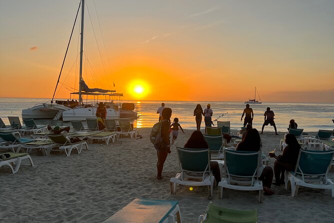 Negril Private Day Tour: ATV Ride, Party Catamaran & Ricks Cafe - Rick’s Cafe sunset stop: cliff jumping and live entertainment