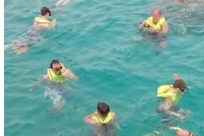 Party Catamaran and Snorkeling Tour in Montego Bay - The onboard party side: music, drinks, and crew energy