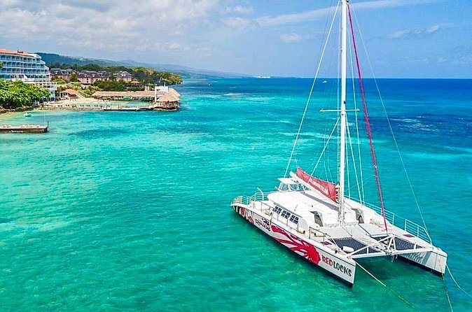 Party Catamaran Cruise with Open Bar and Snorkeling Montego Bay - Stop 1 at Rapsody Tours: where the day begins
