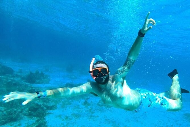 Party Catamaran Cruise with Open Bar and Snorkeling Montego Bay - Snorkeling by a nearby reef: what you should expect