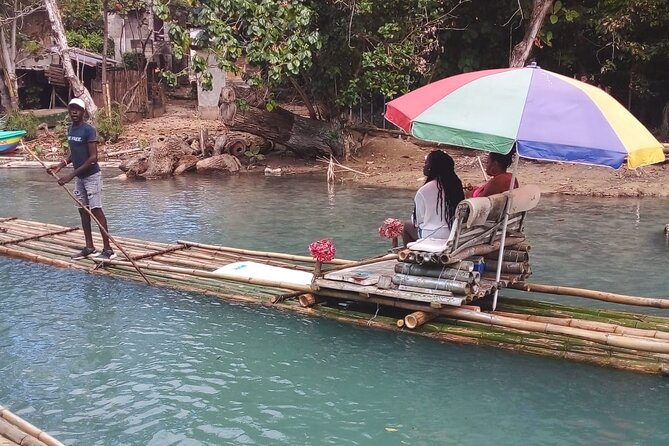 Private River Bamboo Rafting Activity in Ocho Rios Jamaica - Your captain does the driving and the performing