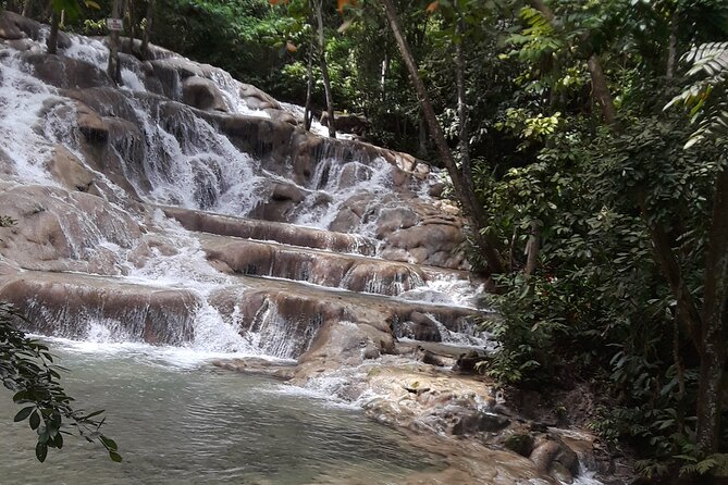 Private Tour to Dunn's River Falls From Ocho Rios - Arriving at Dunn’s River Falls: wristband, beach start, and 600-foot steps