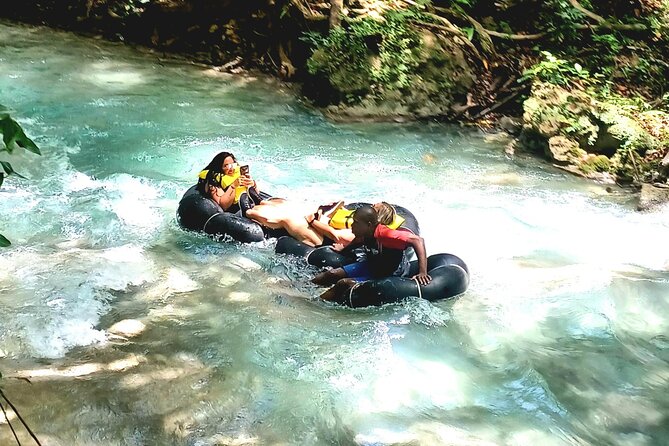 River Tubing and Blue Hole Tour from Ocho Rios - Jumps, swinging, and that rope swing moment