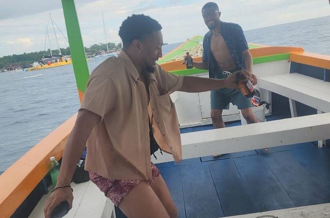Sunset Booze Cruise in Negril - The Ricks Cafe Stop: 45 Minutes of Music, Swimming, and Cliff Energy