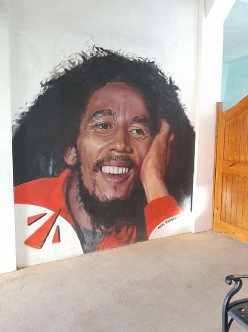 The Official Nine Mile Bob Marley Museum Guided Tour - Colorful murals and documentary-style moments